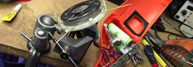 Vacuum cleaner repair parts and tools on a workbench in Overland Park, KS