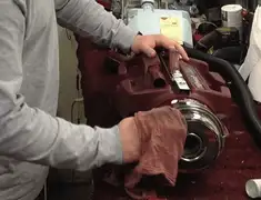 Vacuum repair technician cleaning and servicing a vacuum motor in Overland Park, KS